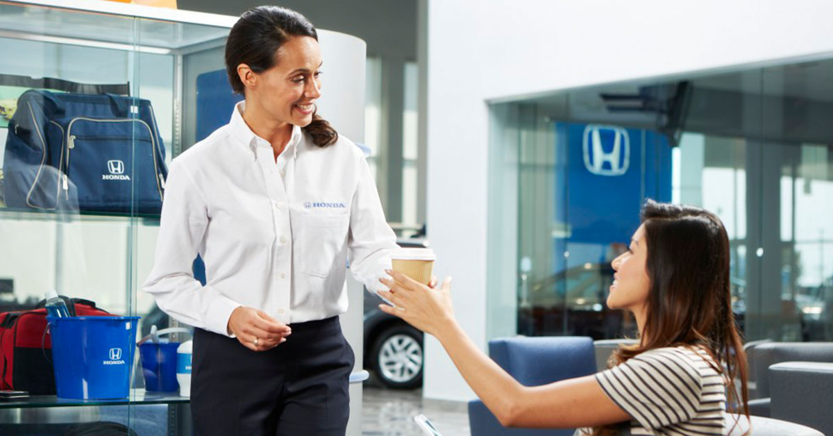 Customer speaking with a sales rep at our Honda dealership in Hampton, VA