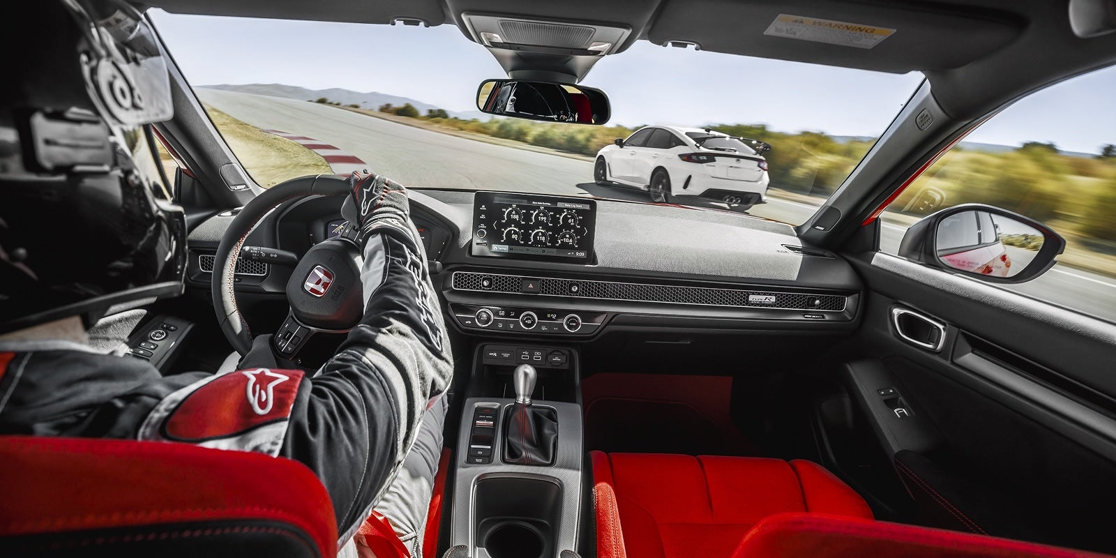 Racer Driving 2026 Honda Civic Type R showcasing power and performance on the road